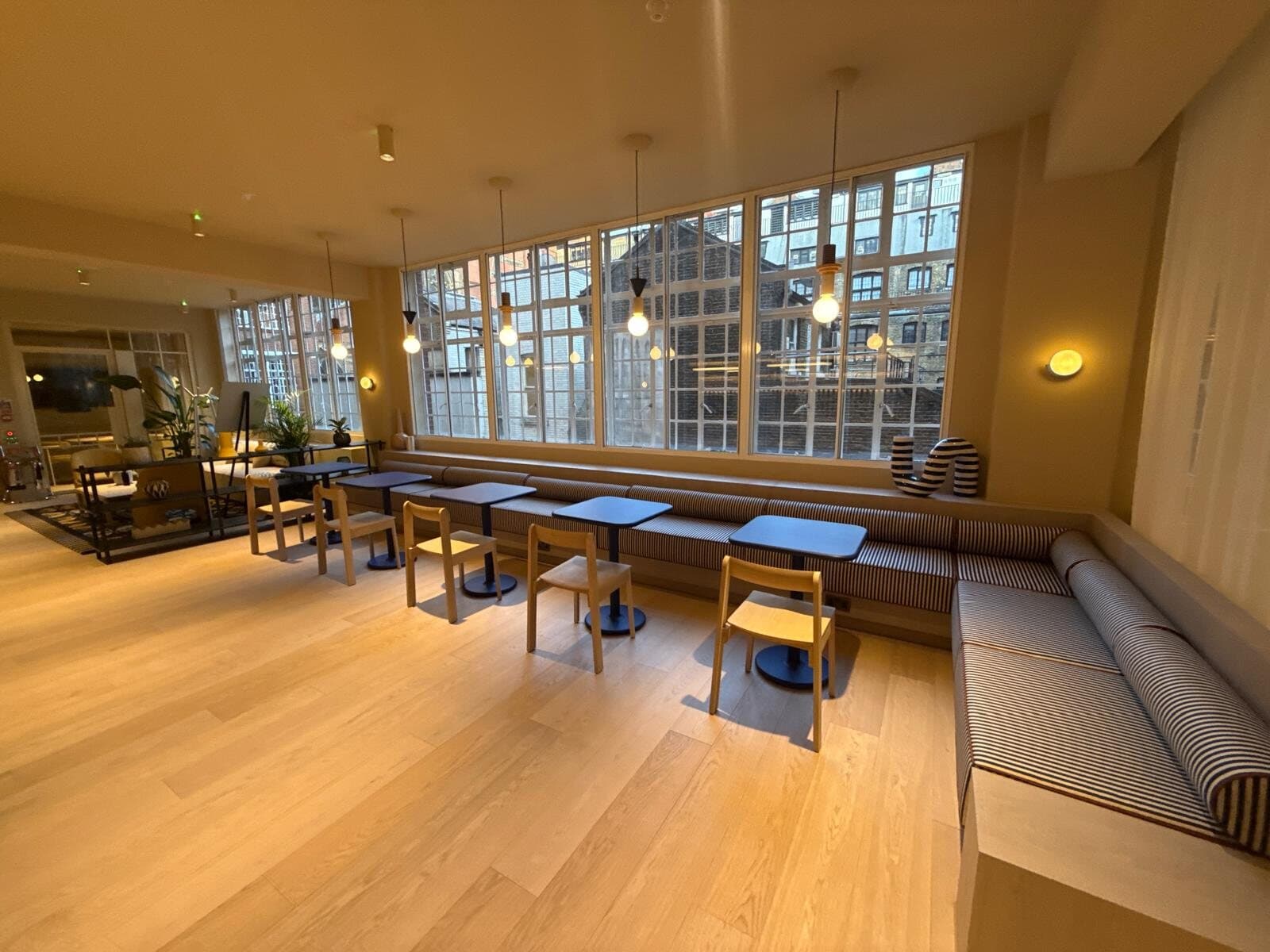 Cafe seating area with new wall and pendant lighting