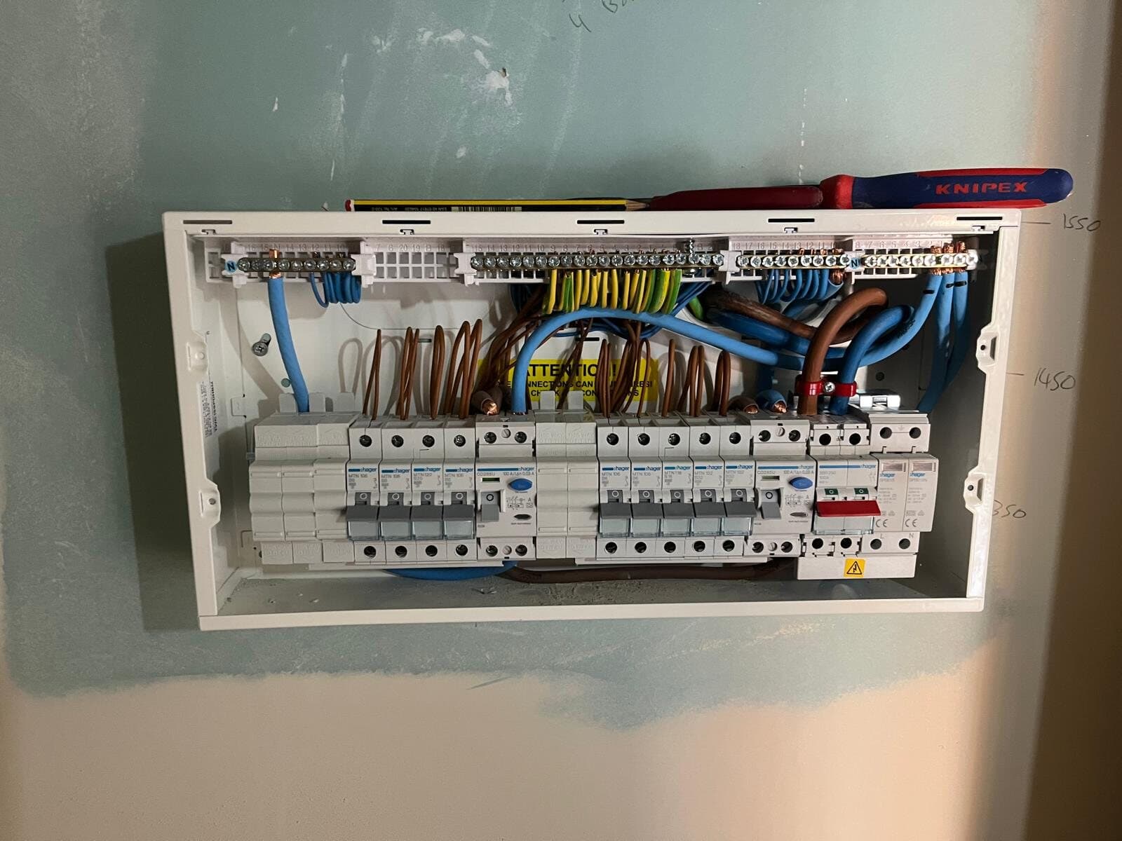 New consumer unit on a freshly plastered wall