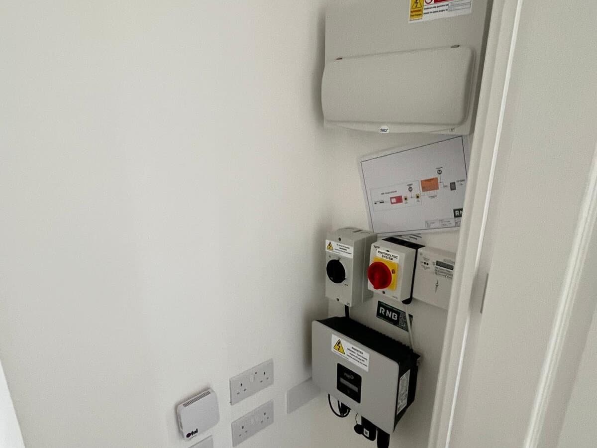 Consumer unit and isolator switches fitted in a cupboard