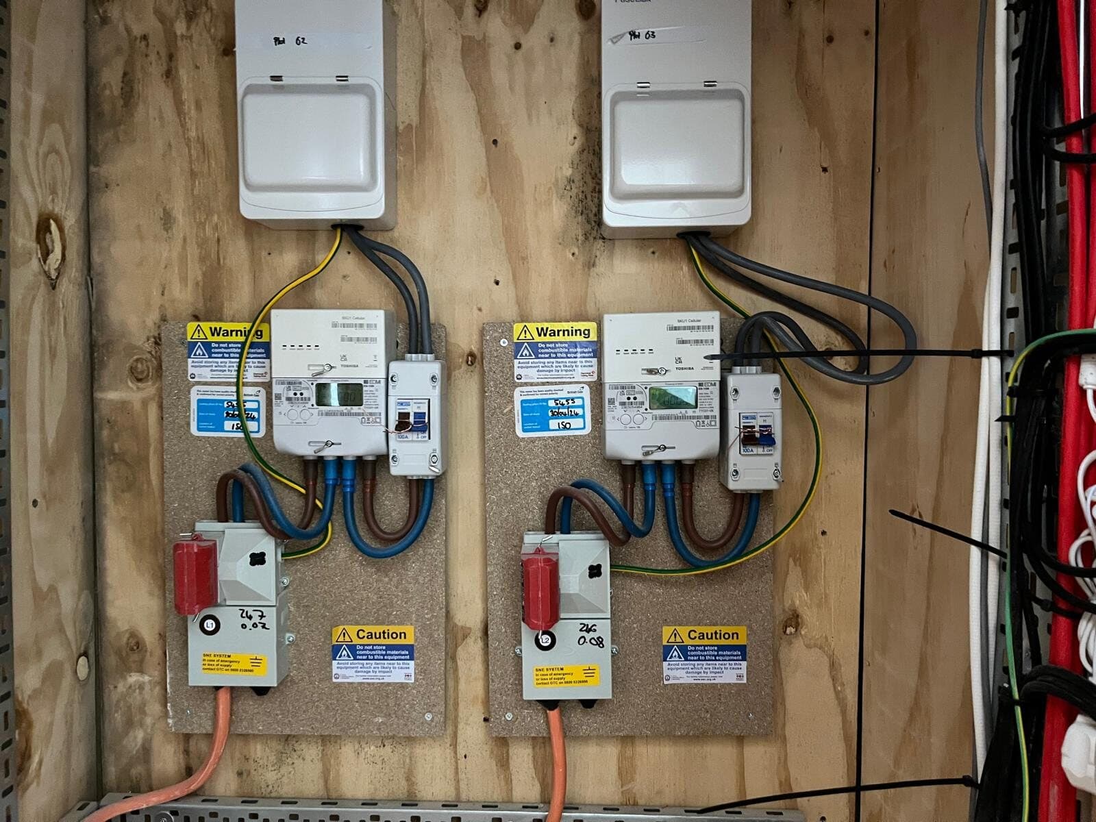 Two new consumer units side by side on a backboard
